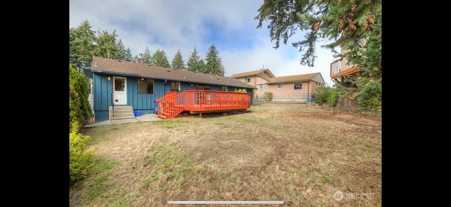 Backyard deck and fully fenced yard.