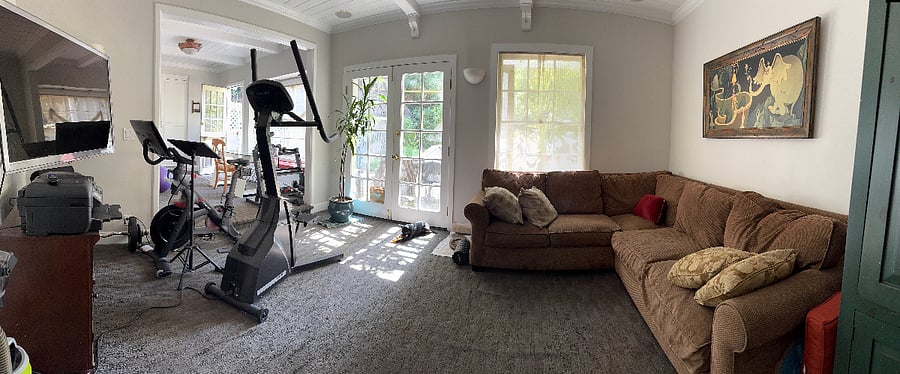 family room with peleton, stairmaster, tv