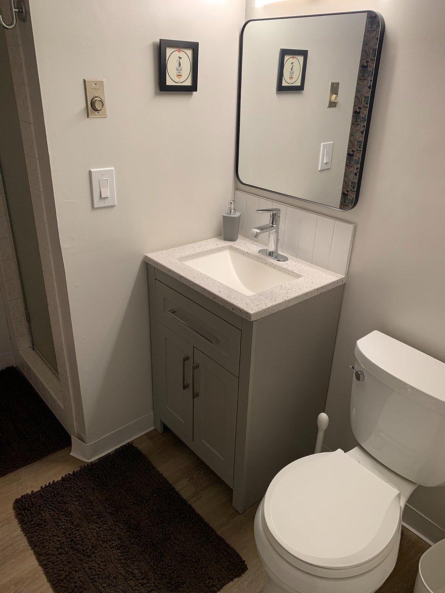 Downstairs - 3/4 bath (small shower, no tub). If this is inadequate, the main bath upstairs is also available.