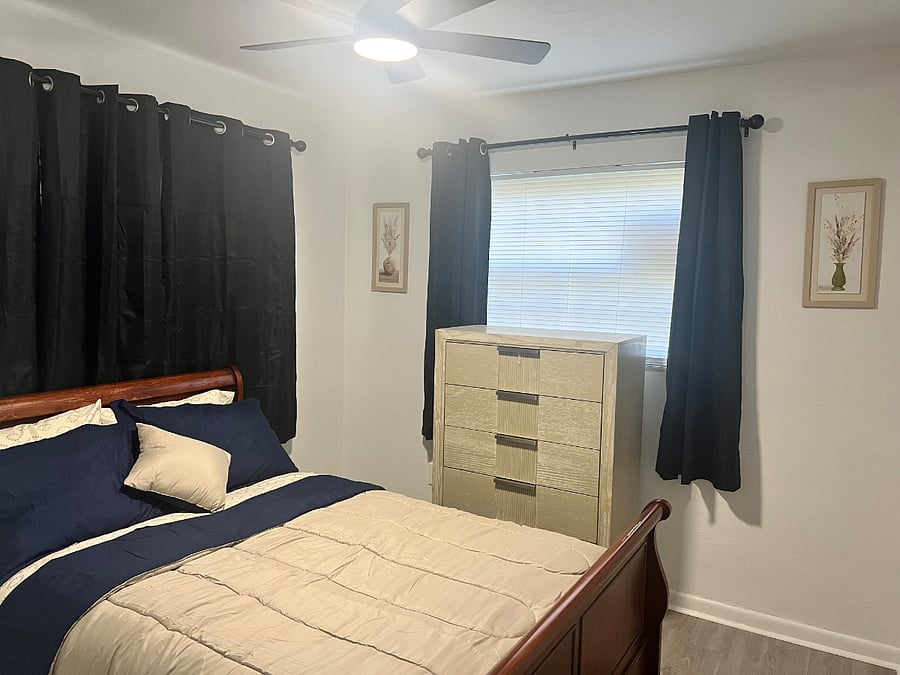 Full size bed with black out curtains