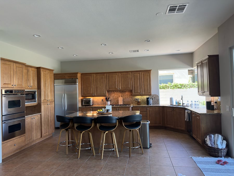 Fully stocked kitchen with toaster oven/air fryer, Nespresso coffee machine, microwave, double ovens, stove with fan, sink with garbage disposal, dishwasher, fridge and freezer with ice maker and portable Sonos speaker.