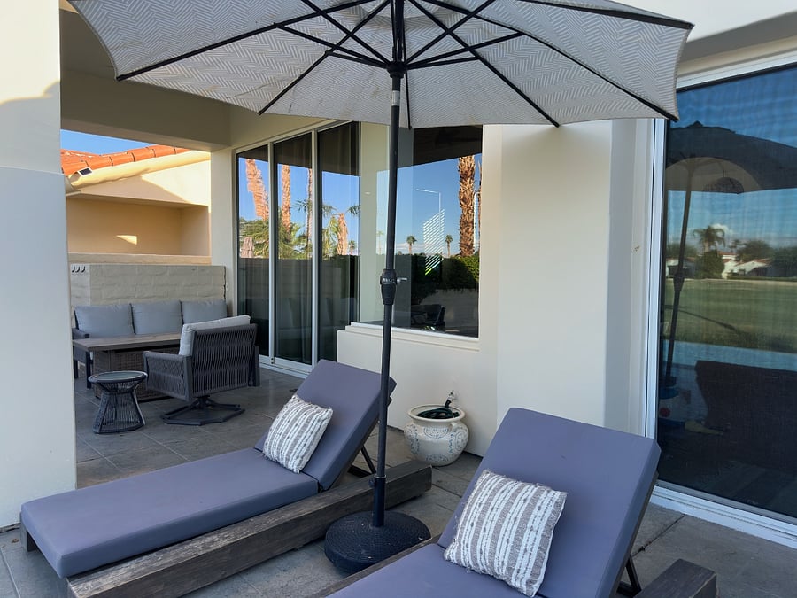 Backyard lounge chairs and umbrella