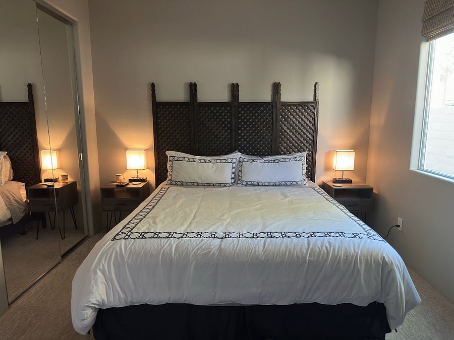 Bedroom #2 with Cal King Bed, ceiling fan, Sonos speaker, smart TV with cable, & full-length mirrors.