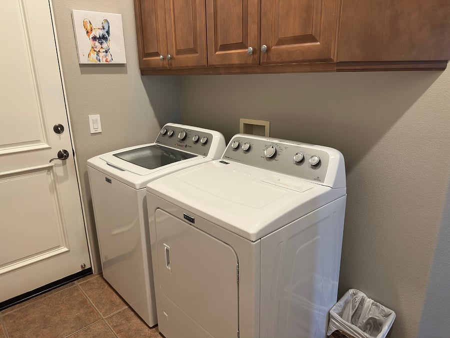 Laundry room with extra large capacity washer and dryer.