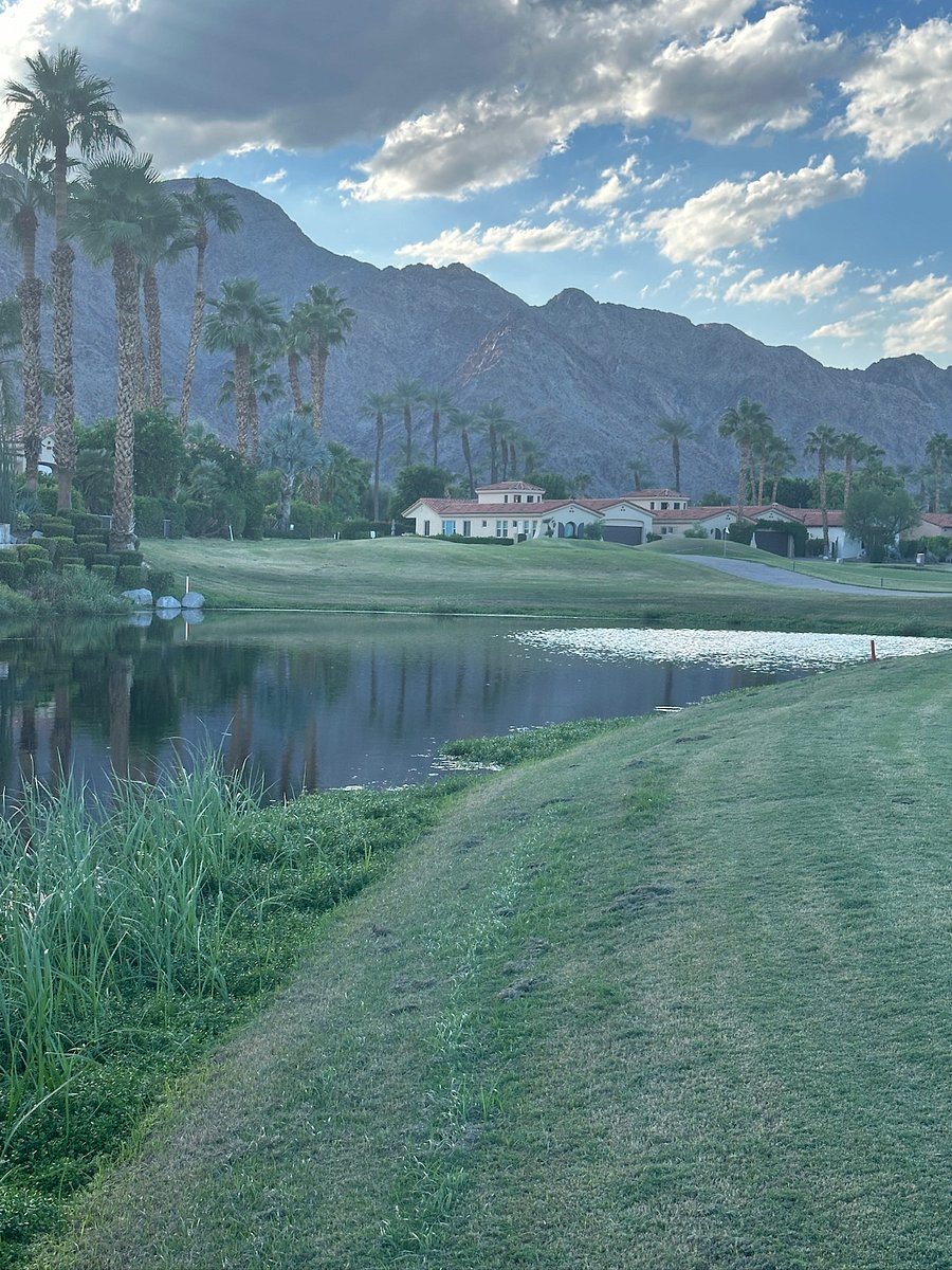 Golf course view behind house
