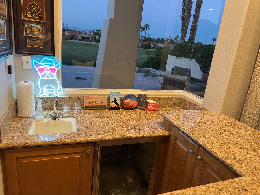 Wet bar with sink and wine fridge.