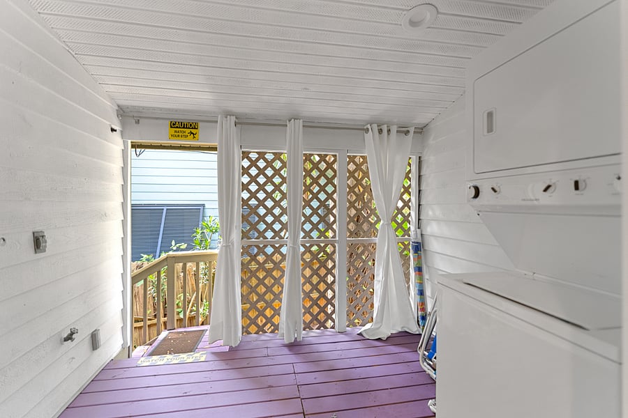 Side porch with wasther & dryer & steps to side yard.