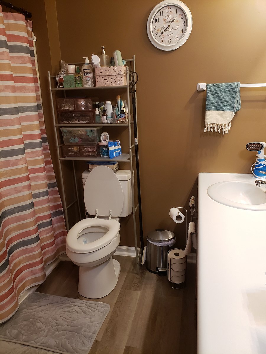 Shared bathroom with twin sinks