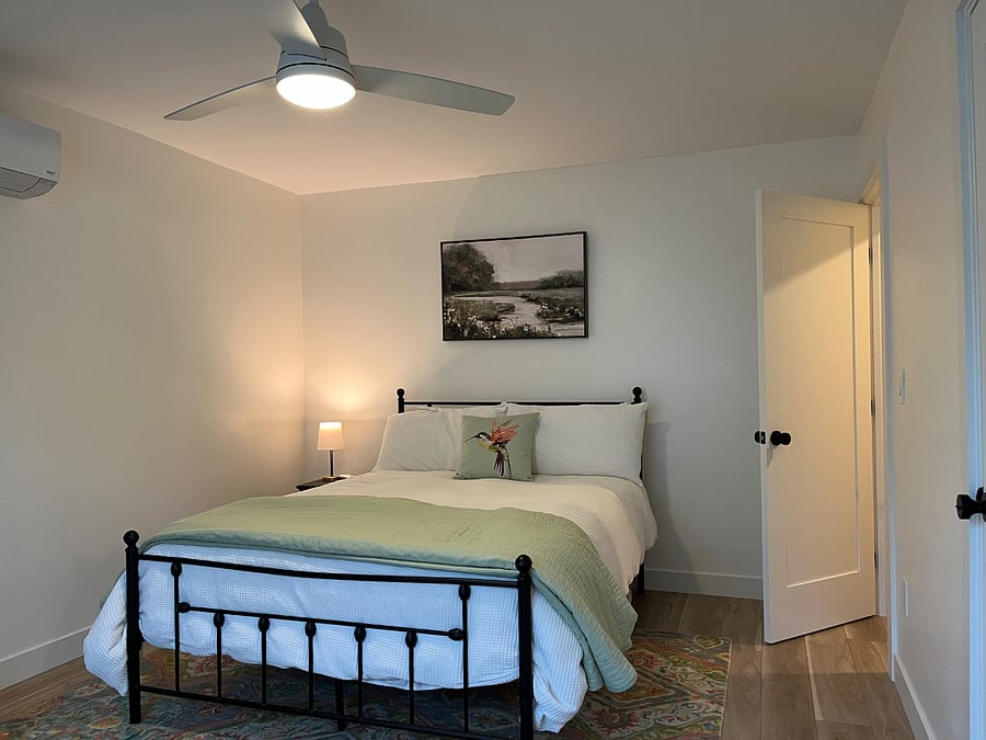 Bedroom with walk-in closet and sitting area.