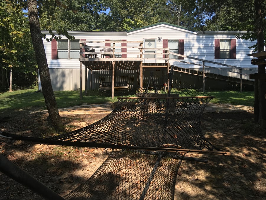 Front of house with large front deck