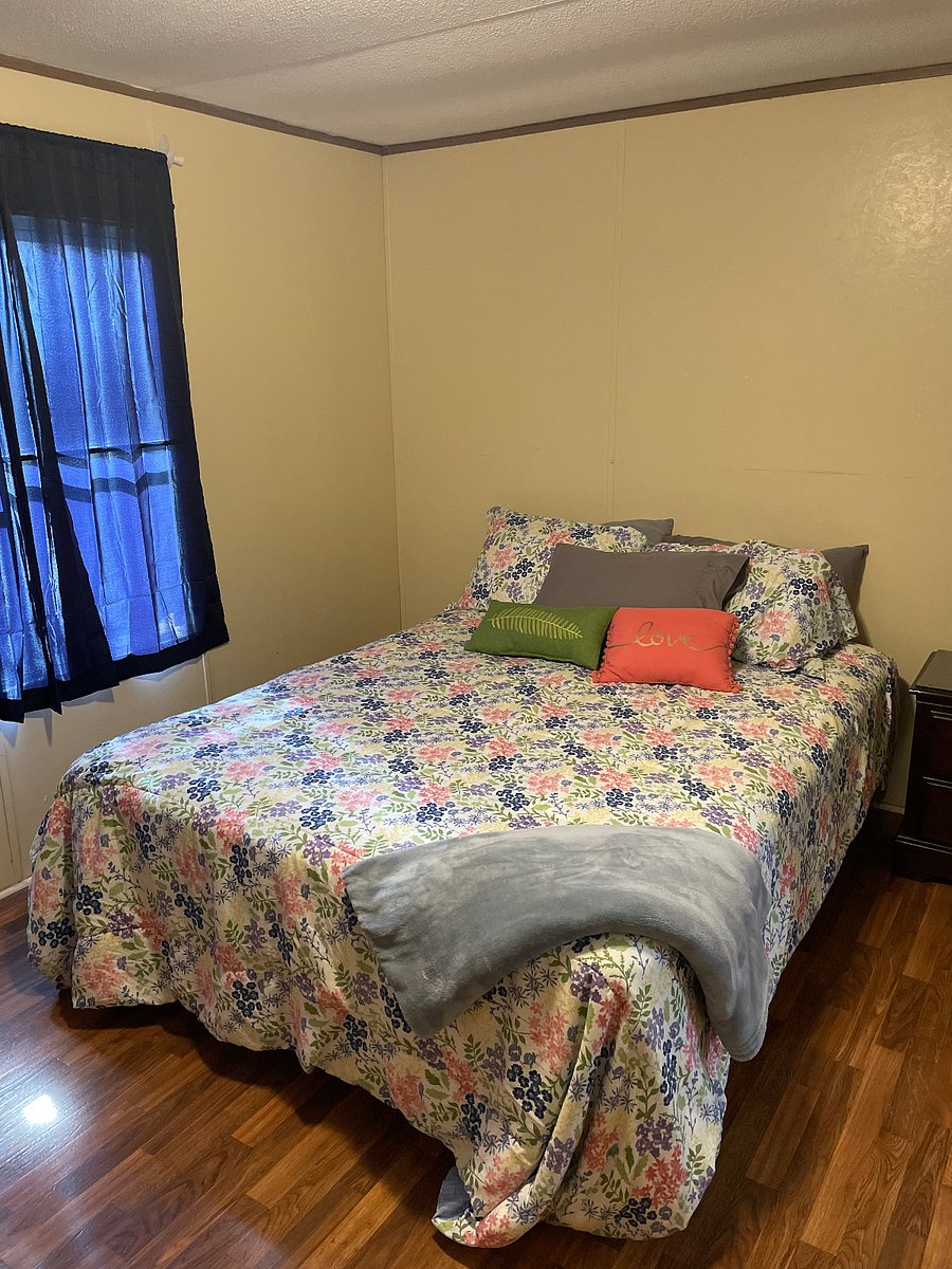 Primary bedroom with attached bathrooom with shower and tub.