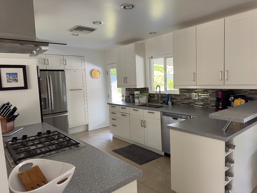 Loaded Kitchen with: new fridge, dishwasher, garbage disposal, convection oven, microwave, gas stove top, tons of storage and stocked with everything to cook, bake, broil, grill and serve!
