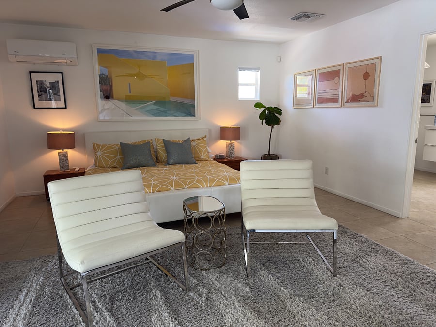HUGE Primary Suite features French doors to pool and spa, telescoping 62" TV with Surround Sound and an oversized ensuite bathroom.