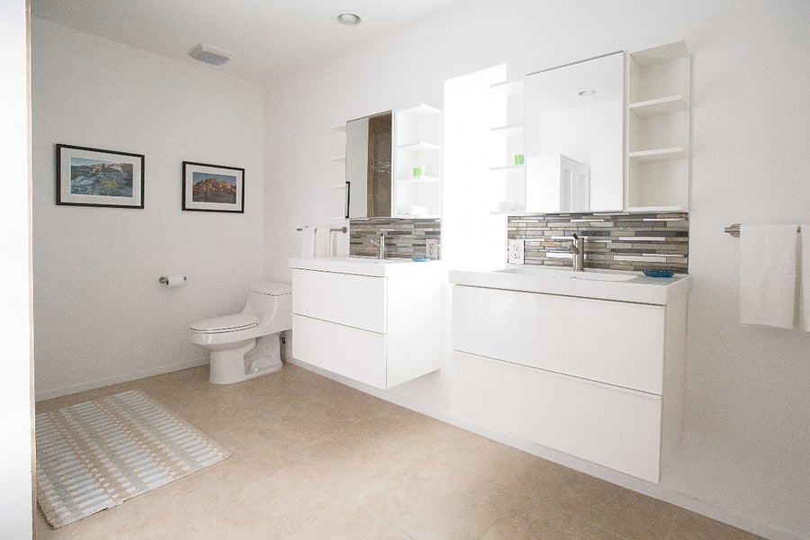 Primary Suite bathroom features two vanities with tons of space.