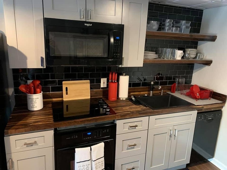 Kitchen with cooktop, oven, microwave, dishwasher, refrigerator