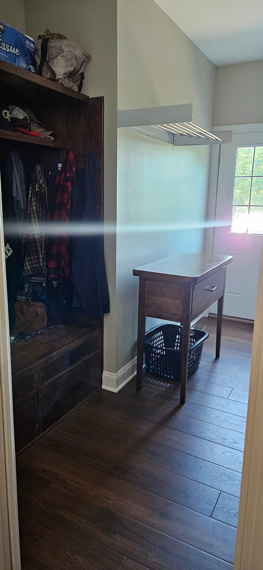 Laundry room coat and shoe storage