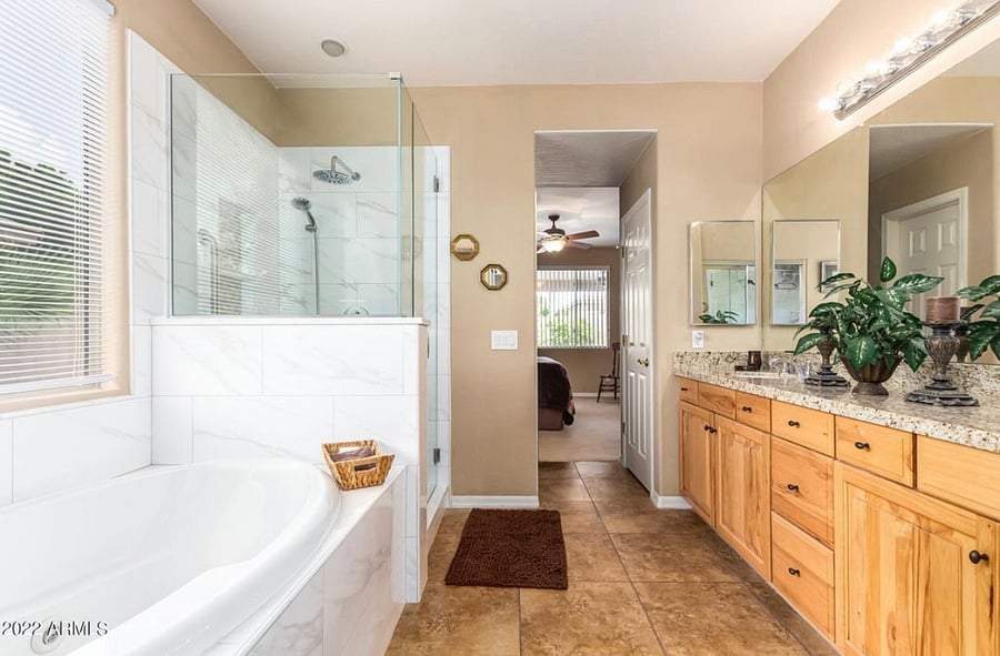 Master bathroom with Jacuzzi bathtub double sinks lots of storage