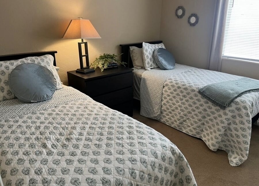 Guest bedroom with two twins, large closet