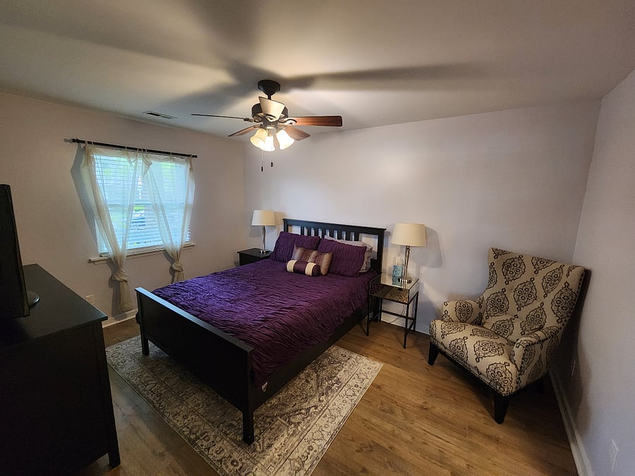 Primary Bedroom with TV, walk-in closet and attached bath