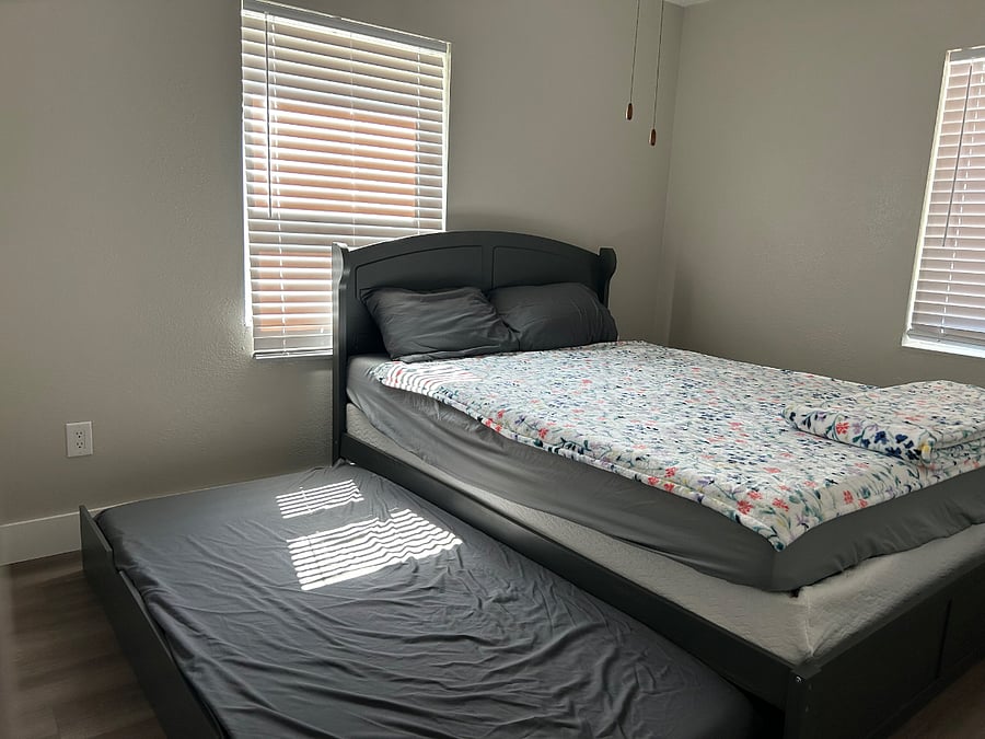 Bedroom 1 with queen bed, twin trundle and full bed with box spring.
