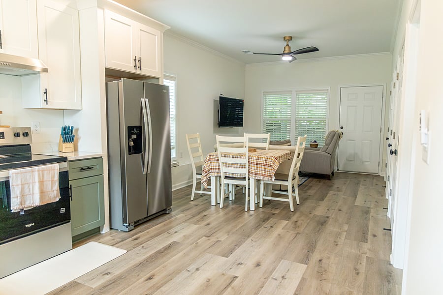 Open concept kitchen, dining, living area. Big TV folds out so you can watch from the kitchen and dining table.