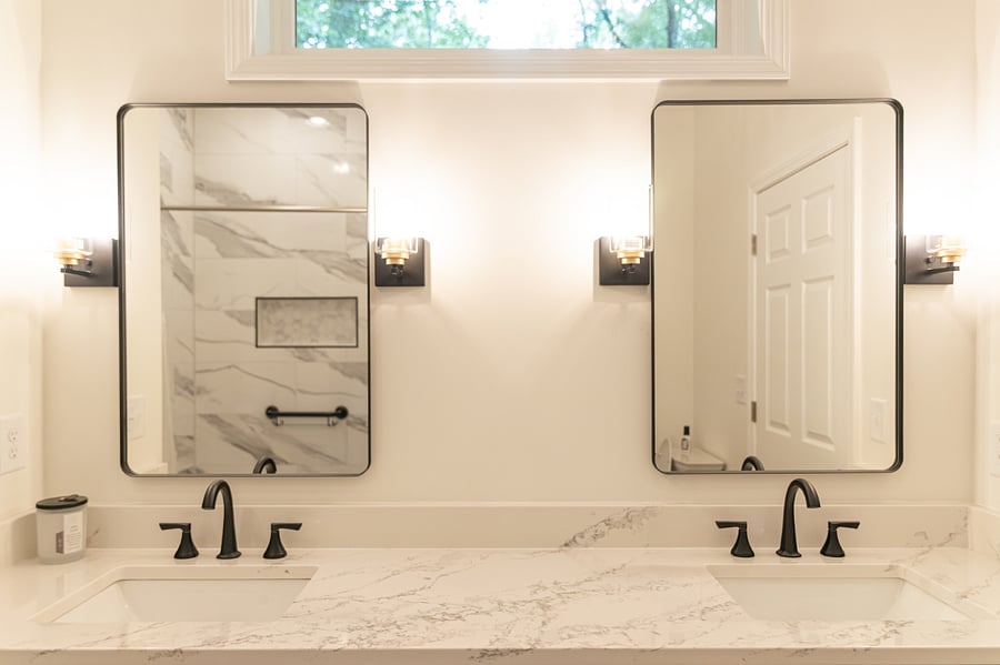 Main full bathroom w/double vanity and walk in shower.  Lots of natural light but VERY private. Which side is your mirror?