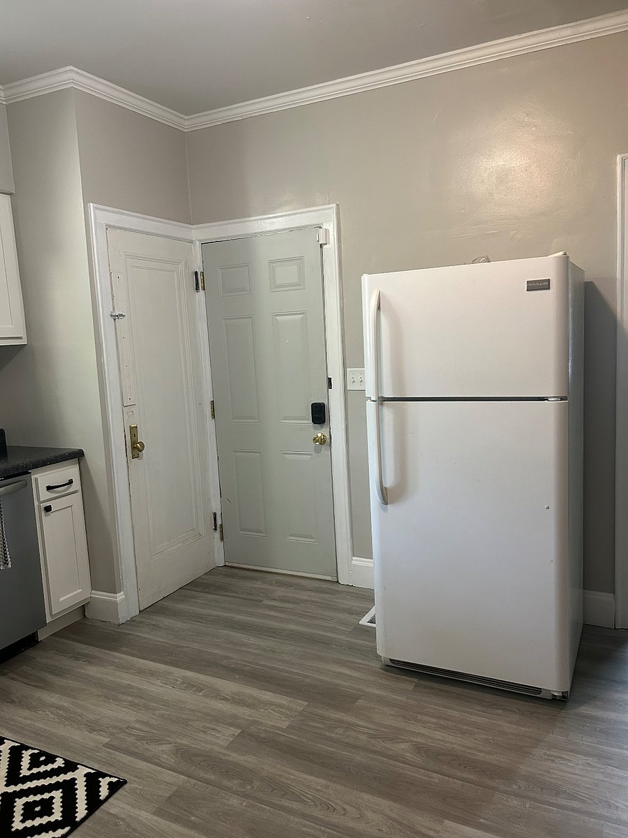 Access the basement and laundry from your ground floor unit. This door is secured with a deadbolt for privacy but you also have access to the backyard from your other door. 