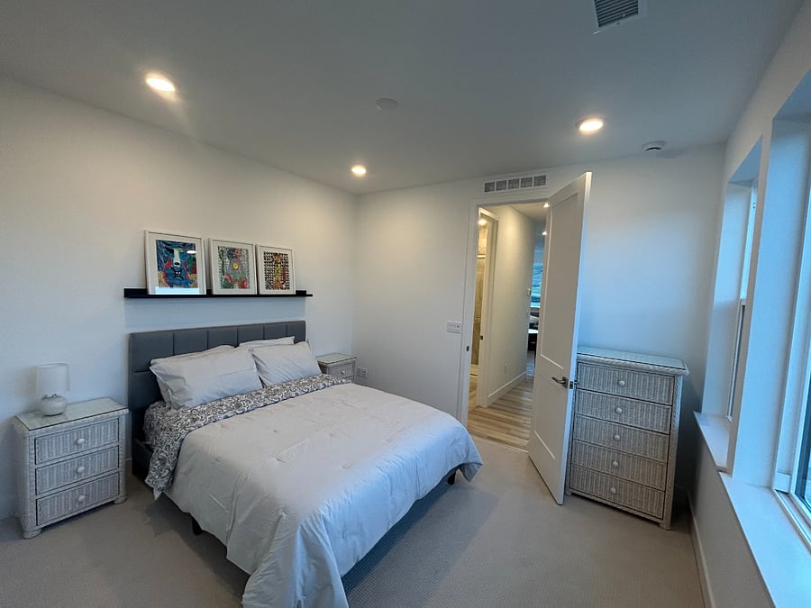 Queen Bed along with two night stands and a dresser