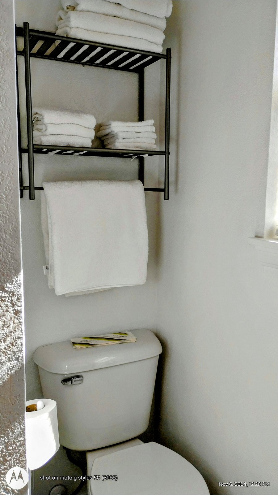 Storage above toilet.