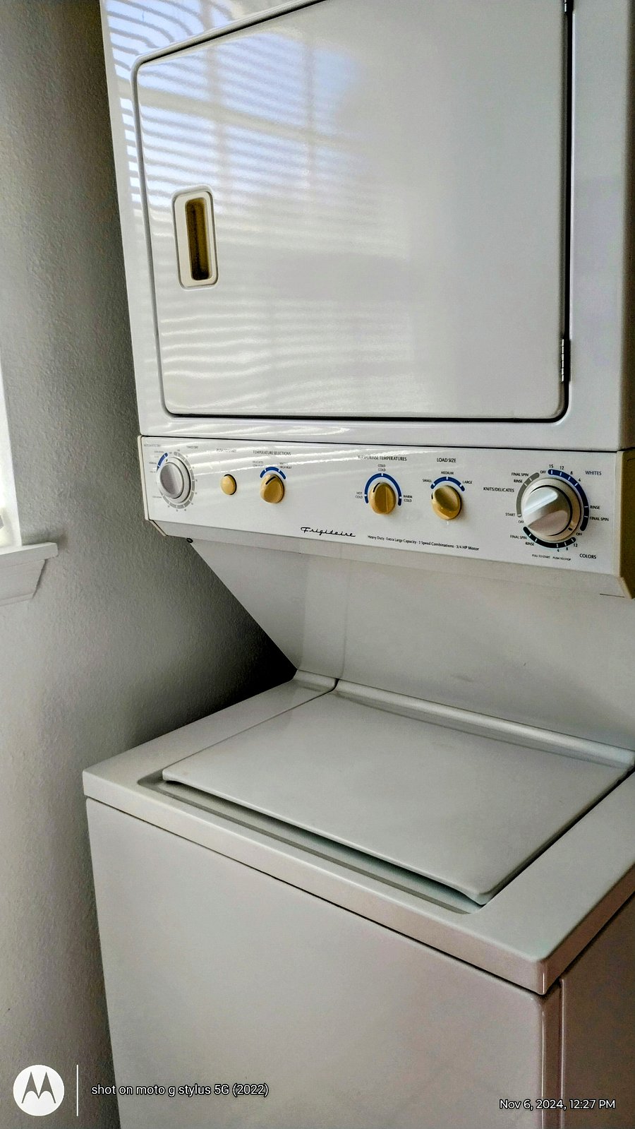 Full size stacking washer and dryer.