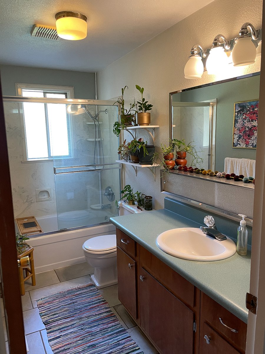 Full bathroom off the hallway, includes bathtub.