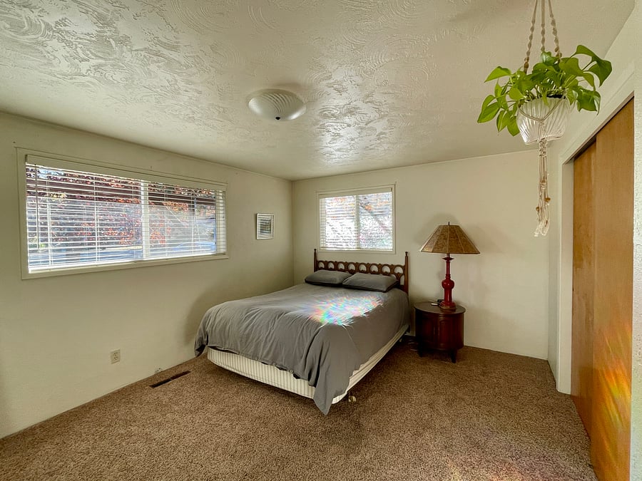 Master bedroom with extra large closet, two windows (facing South and East) as well as a dresser.