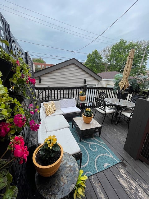 Outdoor dining table with umbrella for shade