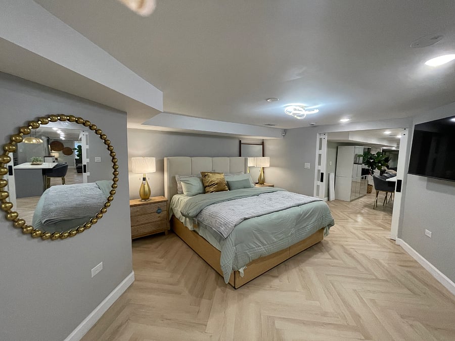 Extra roomy bedroom with king size bed and two dressers for storage. Mattress and pillows encased in protectors and washed and sanitized between guests.