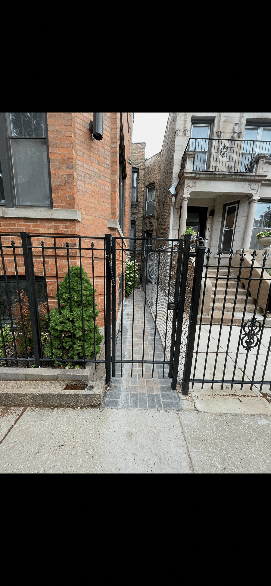 Private gate and walkway to apartment front door