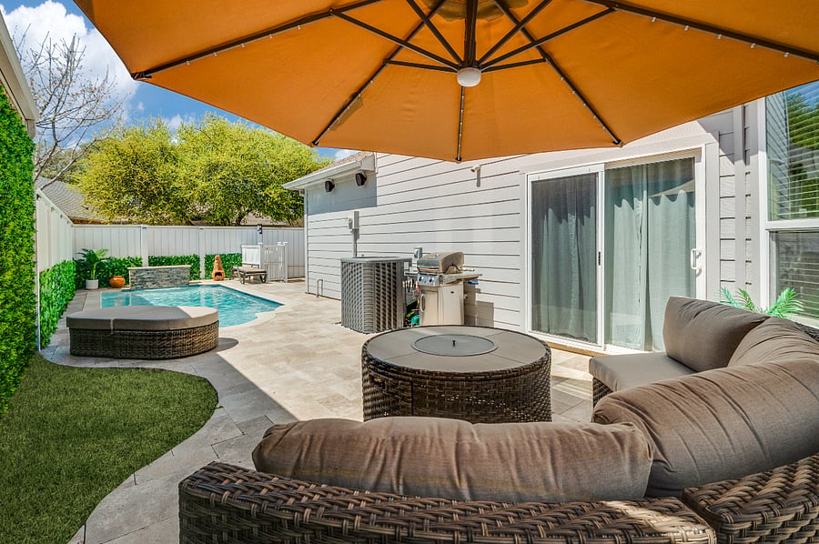 Pool, fire table, umbrella with lighting.