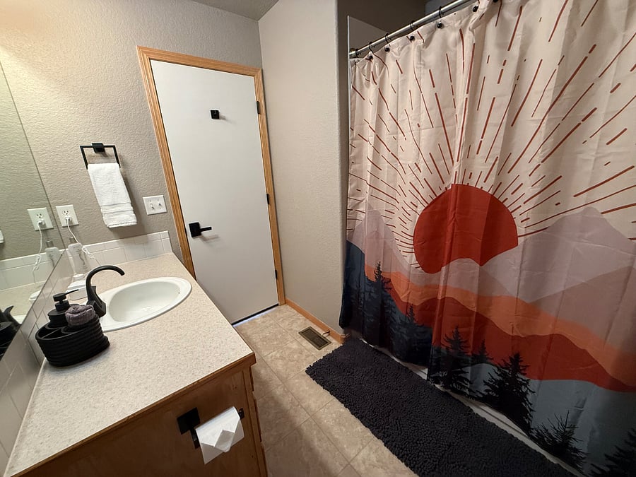 Private bathroom with full tub shower