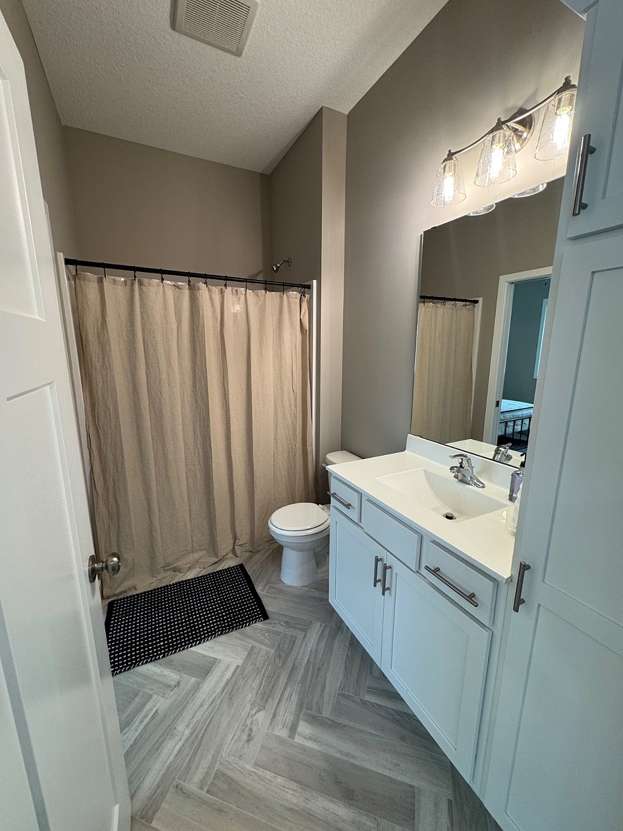 Bathroom accessible from bedroom and living room for guests.