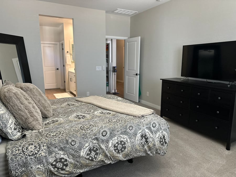 Master Bedroom with dresser and 55" TV