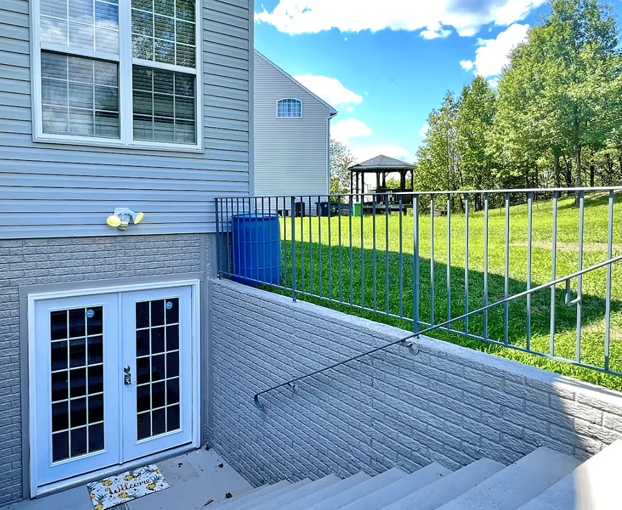 Private entrance with self access key pad. We recently added its own designated sidewalk too.