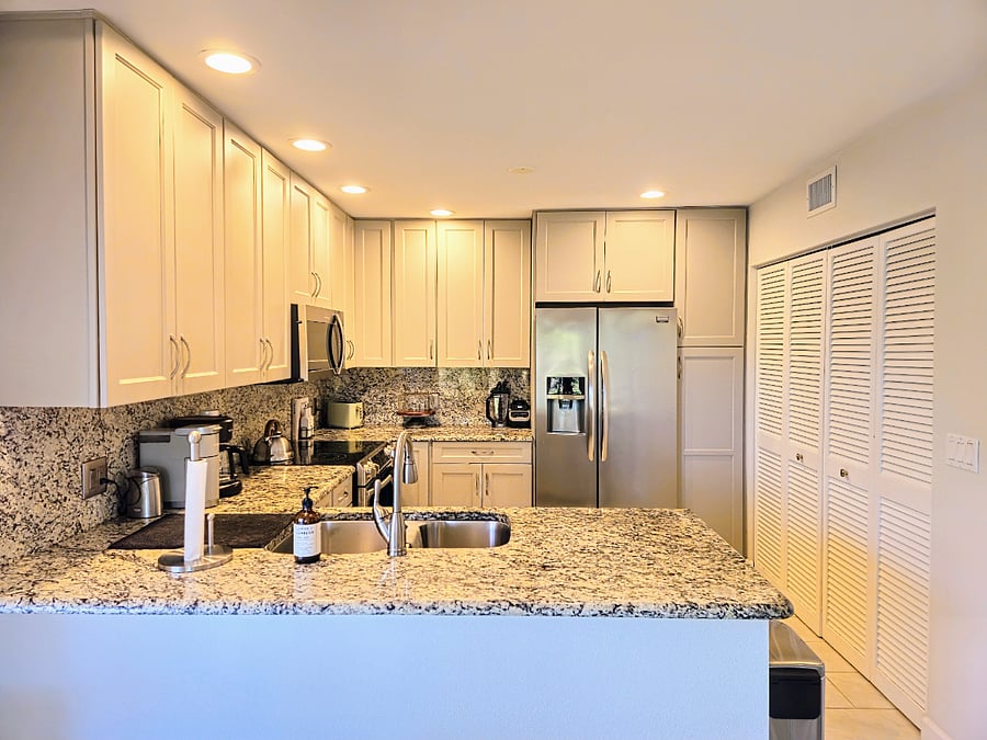 Kitchen with granite countertops and plenty of storage space