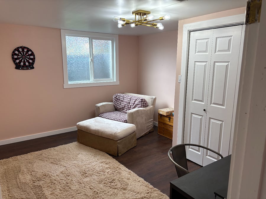 Office with desk and dart board