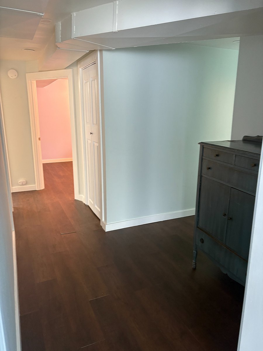 Hall facing bedrooms. Bathroom in hall on right.