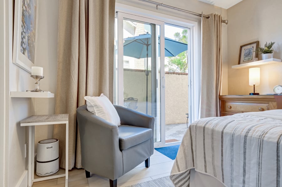Full size bed and sitting area, air purifier. Sliding door is private entrance.
