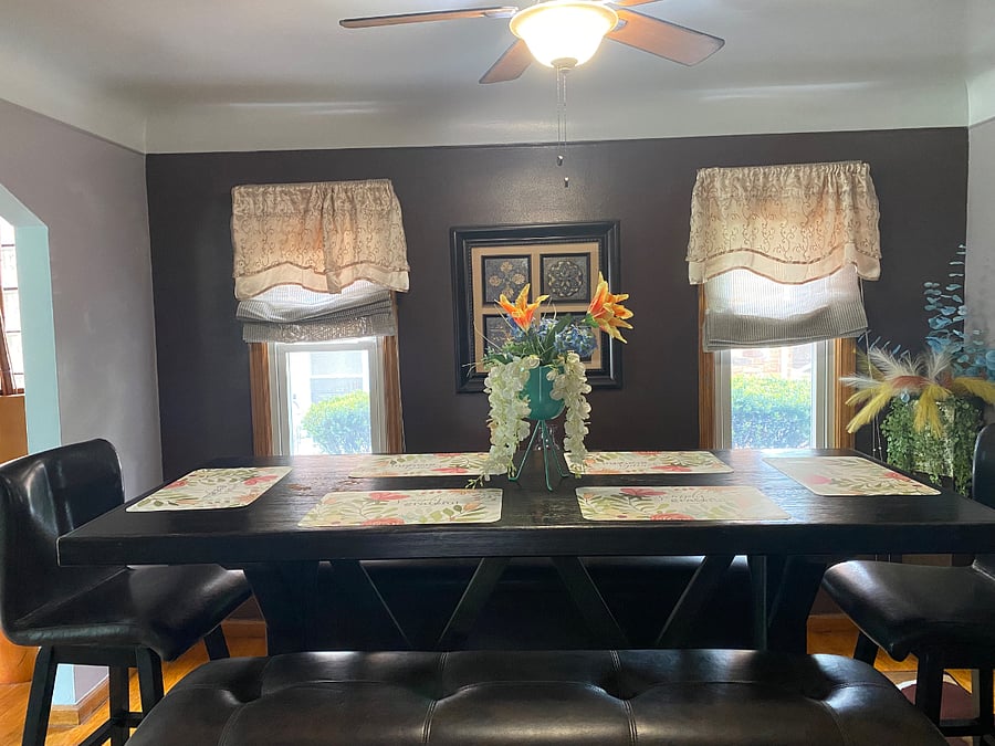 Large bar-height table with chairs and benches
