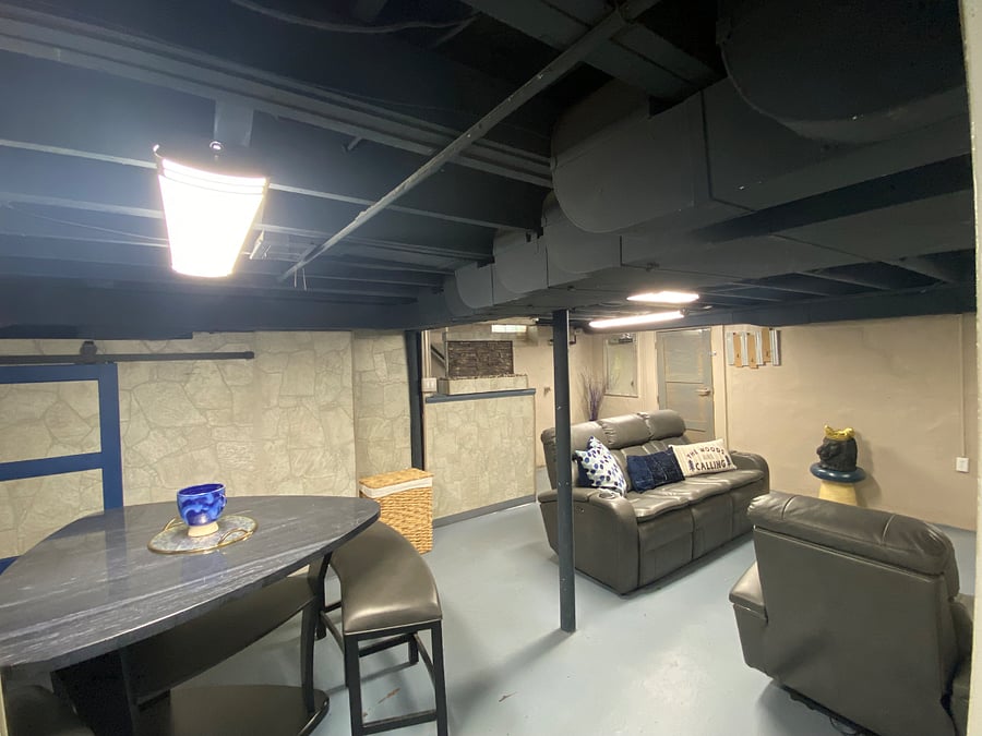 Finished basement with additional dinette table and seating