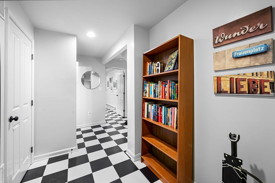 View coming out of the bedroom and looking towards the living room/kitchen. Balthroom is on the left.