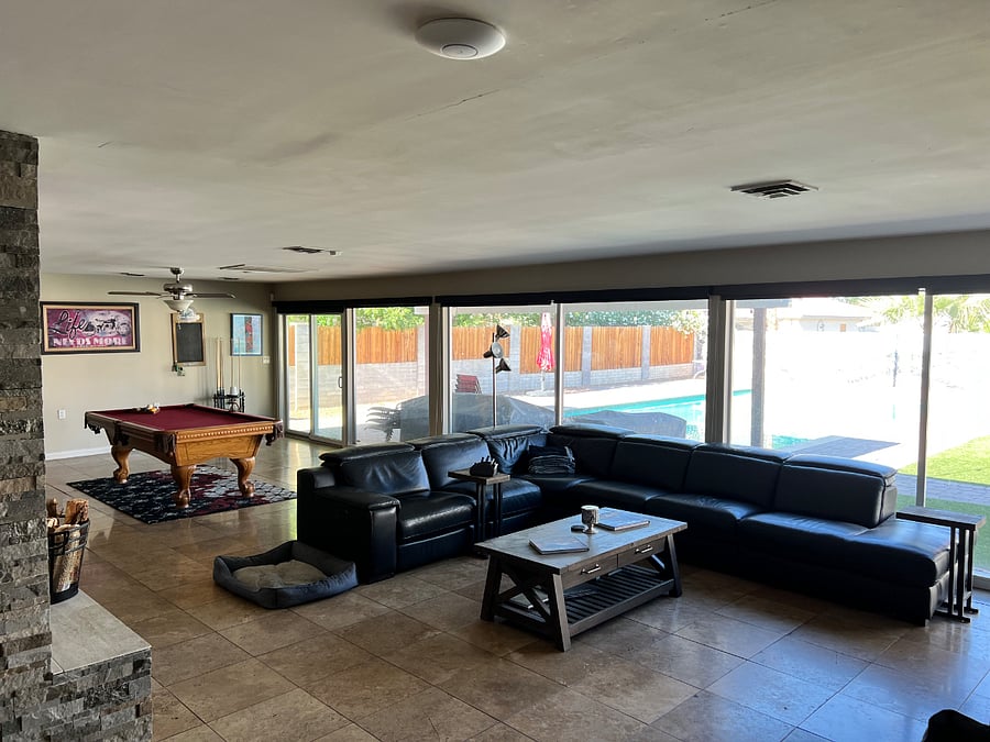 Large shared open space. With living room, couch and 50" TV. Dining room and a pool table.