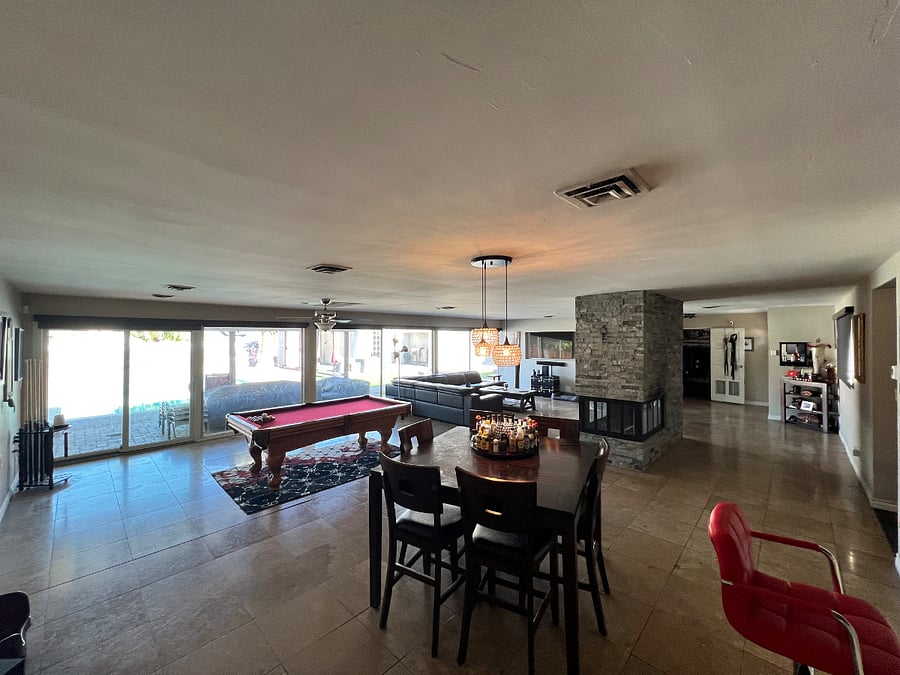 Large shared open space. With living room, couch and 50" TV. Dining room and a pool table.