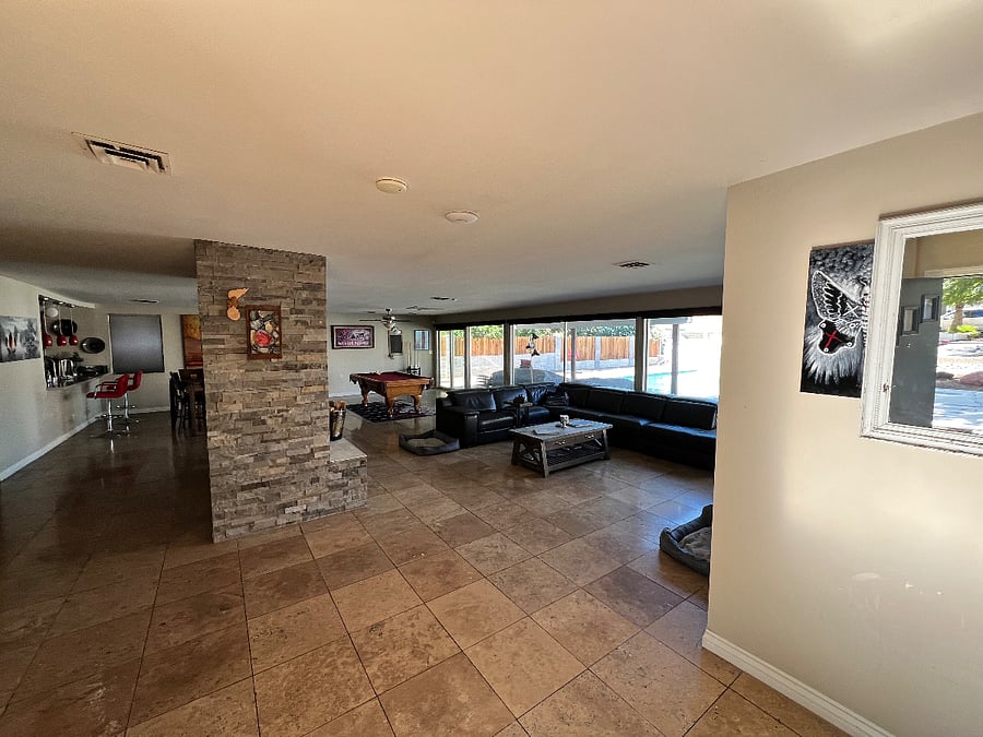 Large shared open space. With living room, couch and 50" TV. Dining room and a pool table.